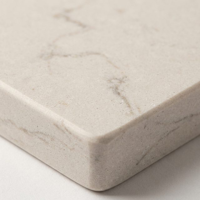 Honed pale quartz countertop with fine warm grey veining